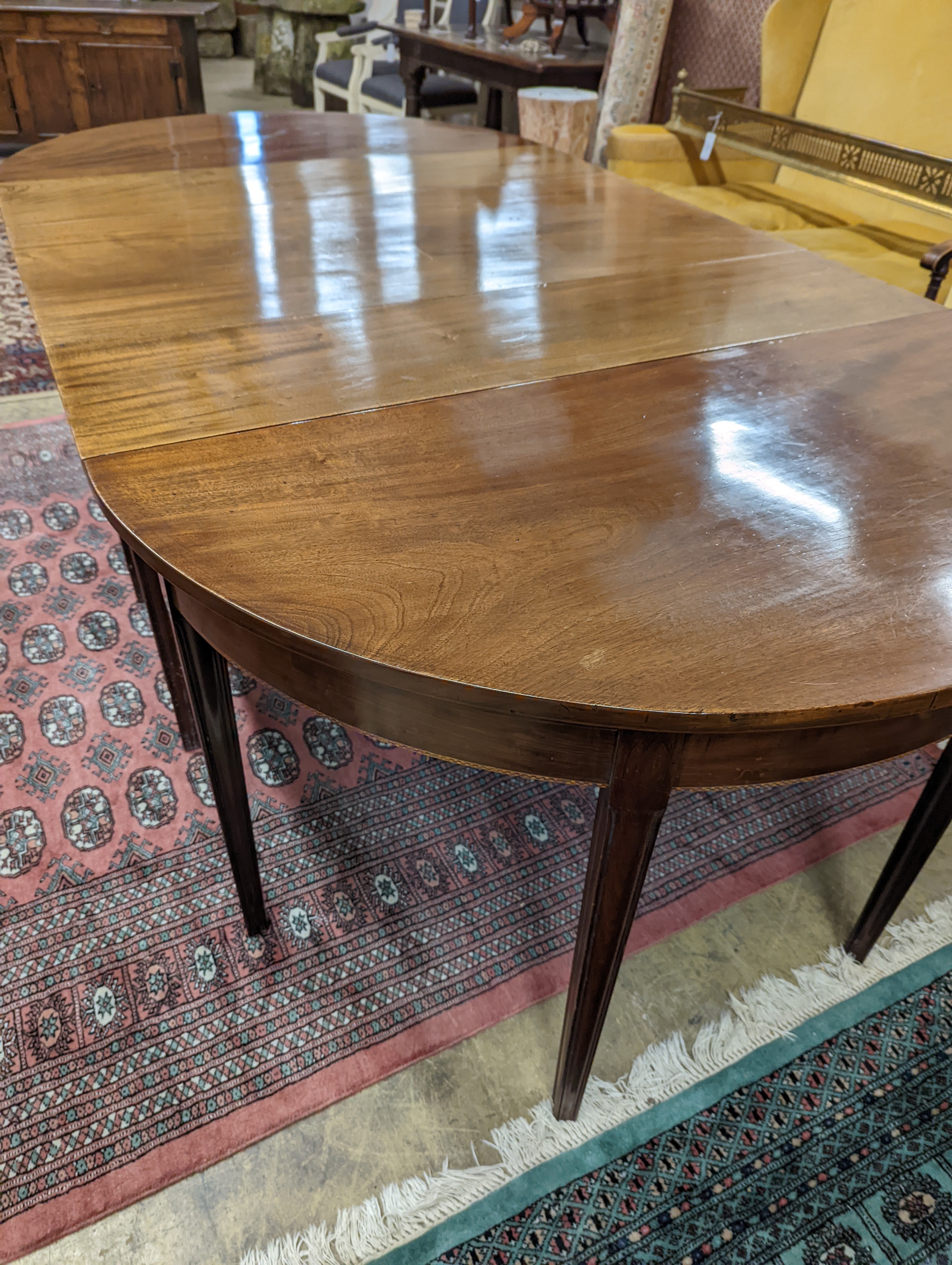 A George III mahogany D end extending dining table, with drop flap central section, length 240cm extended, width 120cm, height 76cm